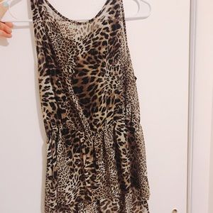 Cheetah print peplum like shirt.